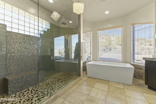 bathroom with tile patterned floors, vanity, and independent shower and bath