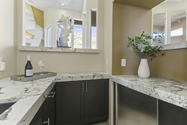 kitchen featuring light stone countertops