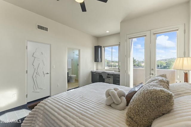 bedroom featuring french doors, connected bathroom, and ceiling fan