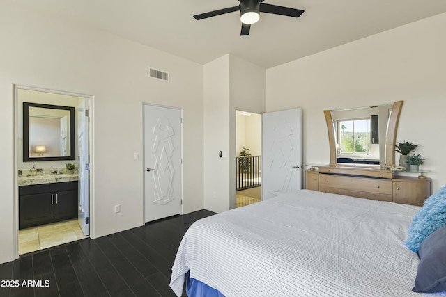 bedroom with ceiling fan and ensuite bath