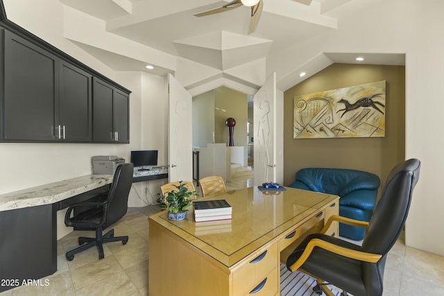 home office featuring built in desk, vaulted ceiling, and light tile patterned flooring