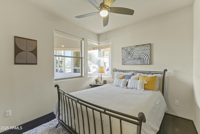 bedroom with ceiling fan and hardwood / wood-style floors