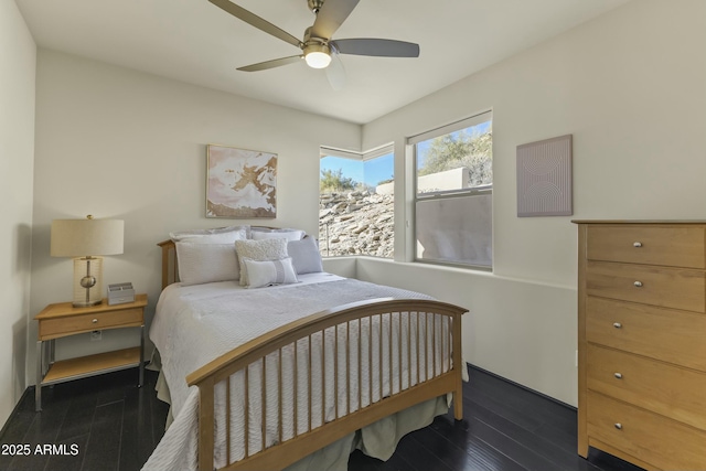 bedroom featuring dark hardwood / wood-style floors and ceiling fan