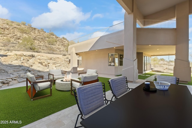 view of patio / terrace featuring a fire pit