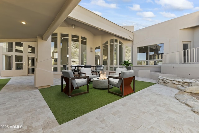 view of patio featuring a fire pit