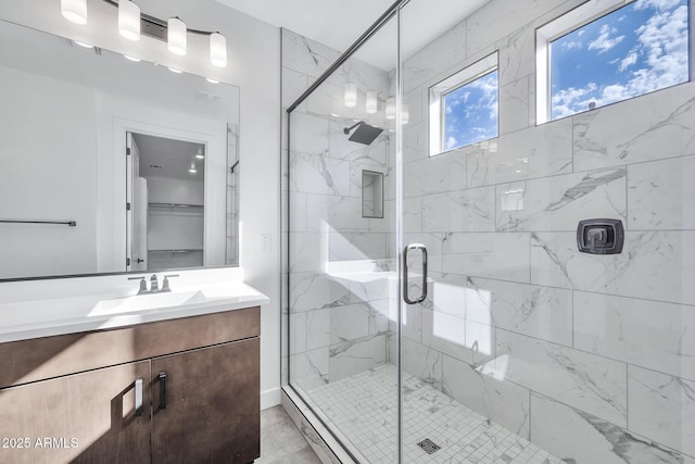 bathroom with vanity and an enclosed shower