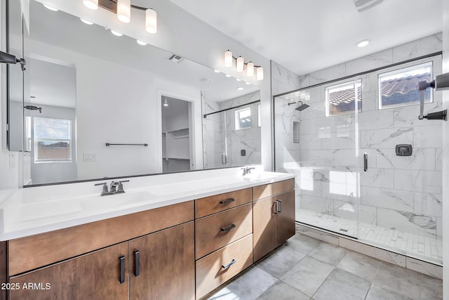 bathroom with an enclosed shower and vanity