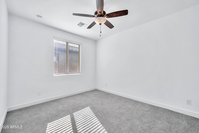 unfurnished room with ceiling fan and carpet flooring