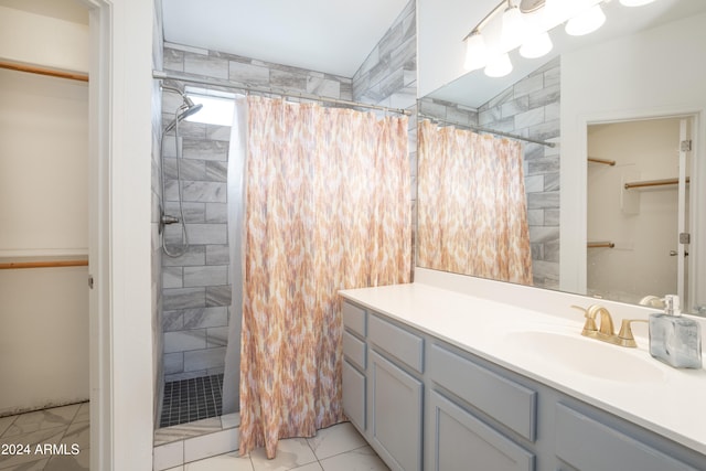 bathroom with a shower with shower curtain, vanity, and lofted ceiling