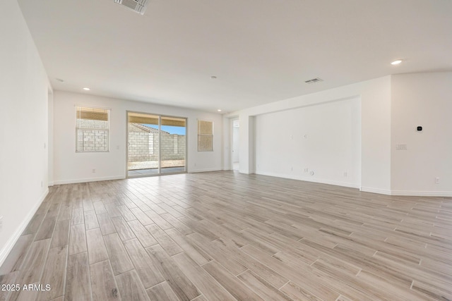 14742 W Lariat Trl, Surprise, AZ 85387 - empty room featuring light wood-style floors, baseboards, and recessed lighting