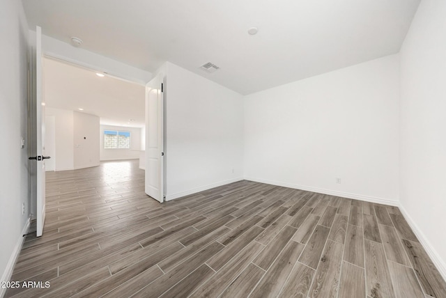 14742 W Lariat Trl, Surprise, AZ 85387 - unfurnished room featuring wood finished floors, baseboards, and a smoke detector