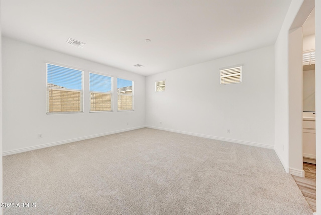 14742 W Lariat Trl, Surprise, AZ 85387 - unfurnished room featuring light carpet and baseboards