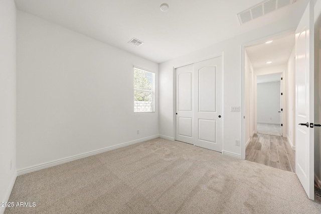 14742 W Lariat Trl, Surprise, AZ 85387 - unfurnished bedroom featuring carpet floors, baseboards, and a closet