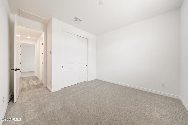 14742 W Lariat Trl, Surprise, AZ 85387 - unfurnished bedroom featuring carpet floors, baseboards, and a closet