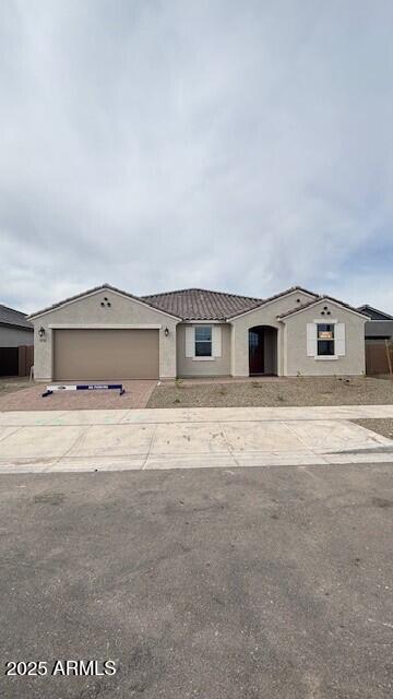 14742 W Lariat Trl, Surprise, AZ 85387 - ranch-style house with concrete driveway, a garage, stucco siding, and a tile roof