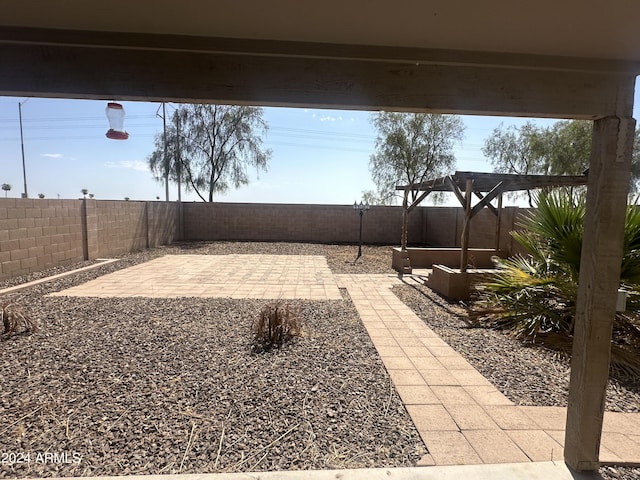 view of yard featuring a patio and a pergola