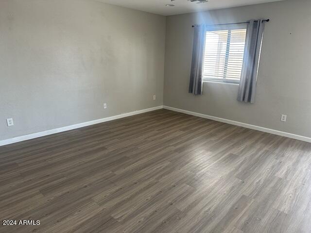 spare room featuring hardwood / wood-style flooring