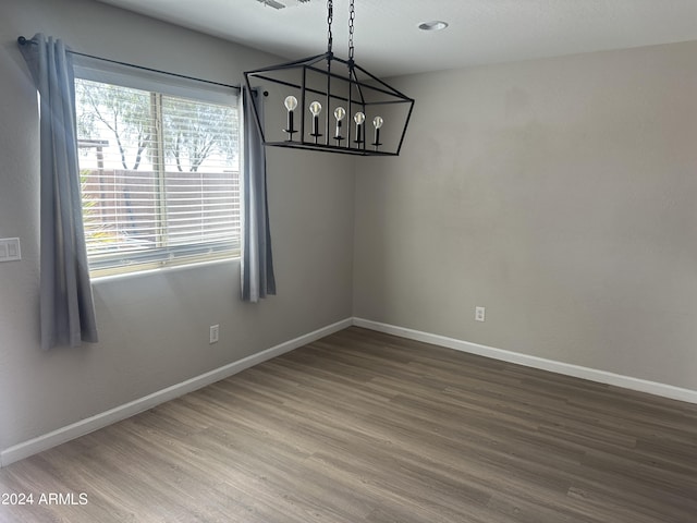 unfurnished dining area featuring hardwood / wood-style floors