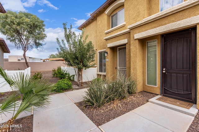 entrance to property featuring a patio area