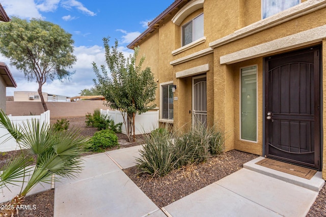 entrance to property featuring a patio area