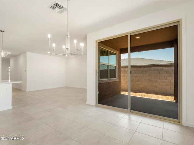 unfurnished dining area featuring light tile patterned floors and a chandelier