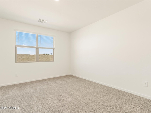 spare room with carpet floors