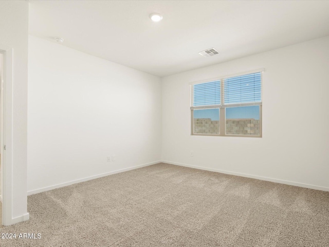 spare room featuring carpet flooring