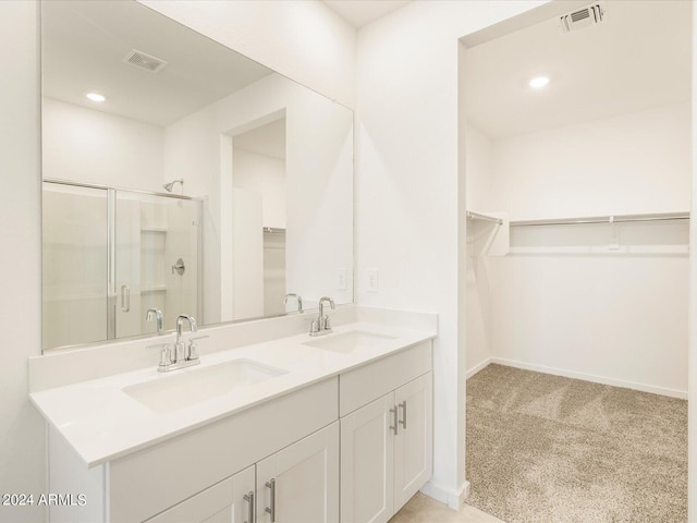 bathroom with vanity and an enclosed shower