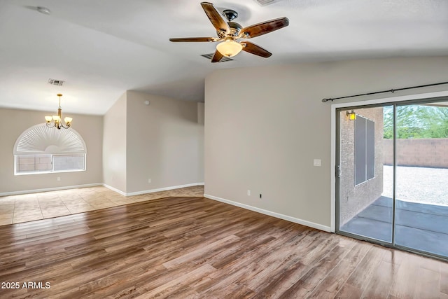 12441 W Windsor Blvd, Litchfield Park, AZ 85340 - spare room with wood finished floors, a chandelier, ceiling fan, baseboards, and lofted ceiling