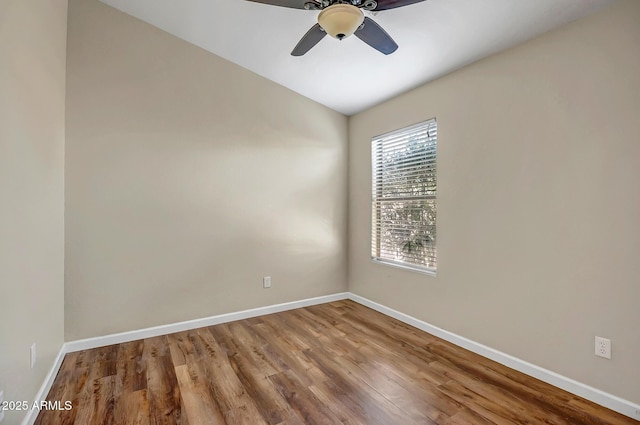 12441 W Windsor Blvd, Litchfield Park, AZ 85340 - unfurnished room featuring ceiling fan, wood finished floors, baseboards, and lofted ceiling