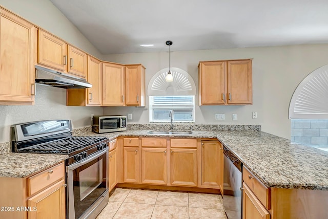 12441 W Windsor Blvd, Litchfield Park, AZ 85340 - kitchen featuring appliances with stainless steel finishes, under cabinet range hood, a sink, a peninsula, and light brown cabinetry