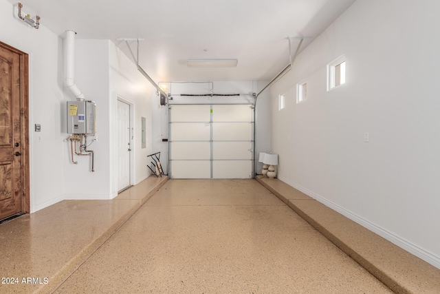 garage featuring tankless water heater