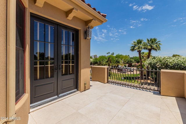 exterior space featuring french doors and a balcony