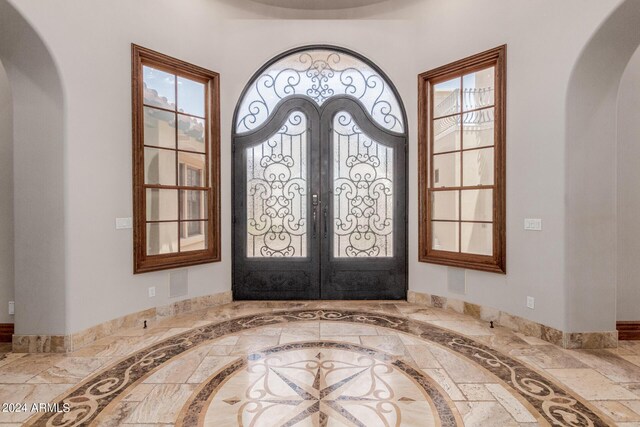 entryway featuring french doors