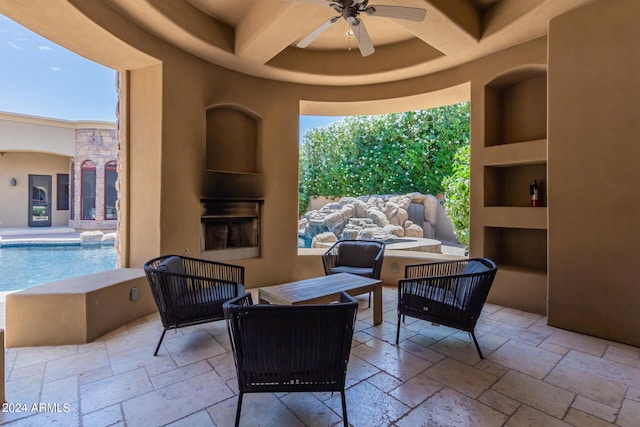 view of patio / terrace with ceiling fan and an outdoor living space