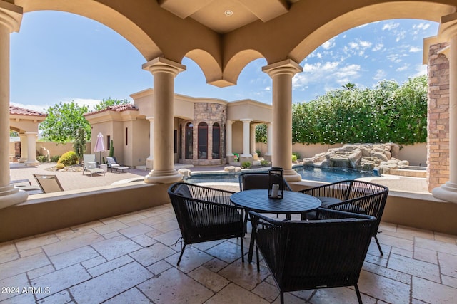 view of patio featuring pool water feature