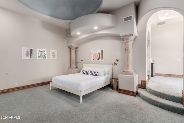 carpeted bedroom featuring a high ceiling