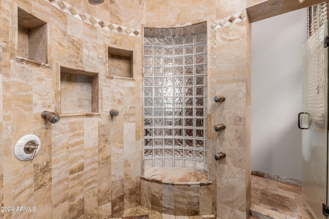 bathroom with a shower with shower door