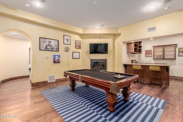 rec room featuring dark hardwood / wood-style flooring, wet bar, and pool table