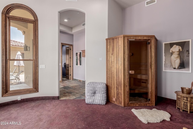 bedroom with dark colored carpet