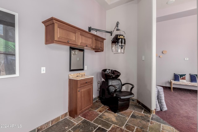 kitchen featuring dark colored carpet