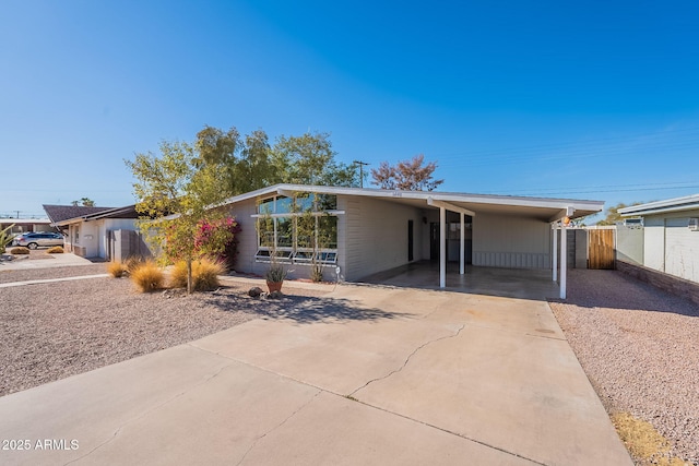 single story home with a carport