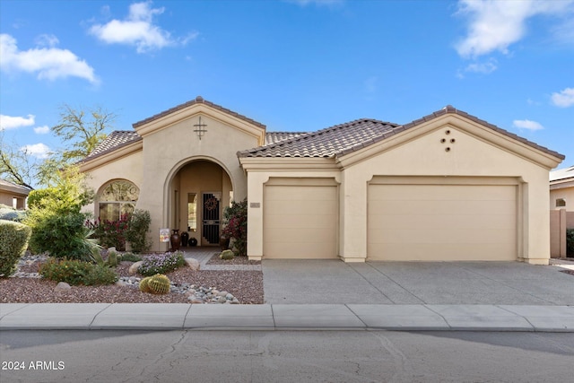 mediterranean / spanish-style house featuring a garage