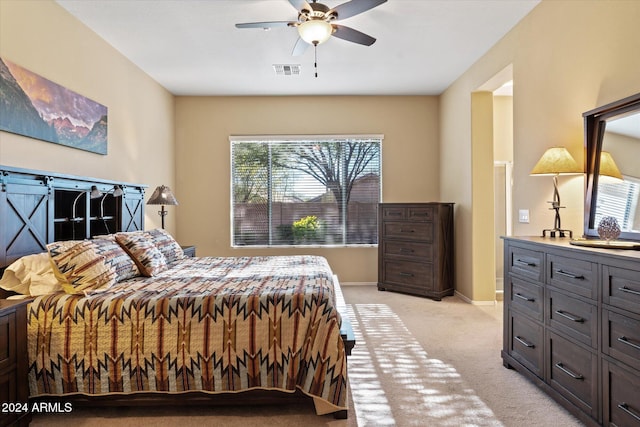 carpeted bedroom with ceiling fan