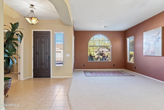 foyer featuring light tile patterned floors