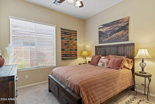 bedroom featuring ceiling fan and light carpet