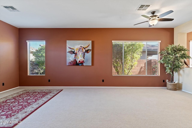 unfurnished room featuring carpet flooring and ceiling fan