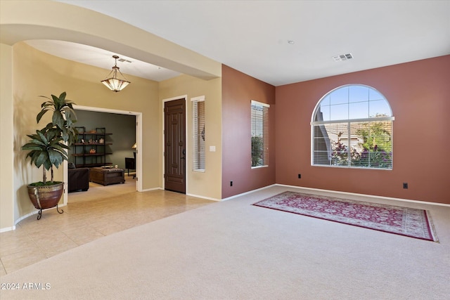 view of carpeted foyer