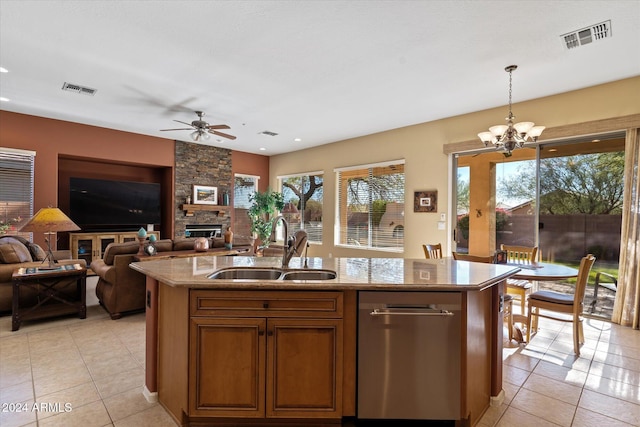 kitchen featuring a center island with sink, plenty of natural light, and sink