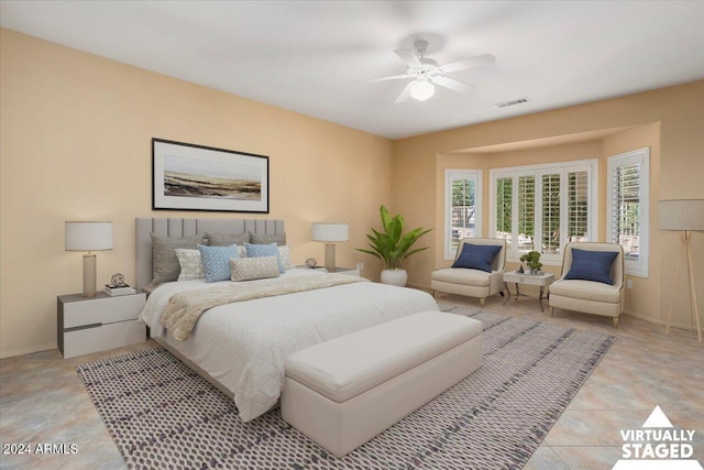 bedroom featuring baseboards, light tile patterned flooring, visible vents, and a ceiling fan